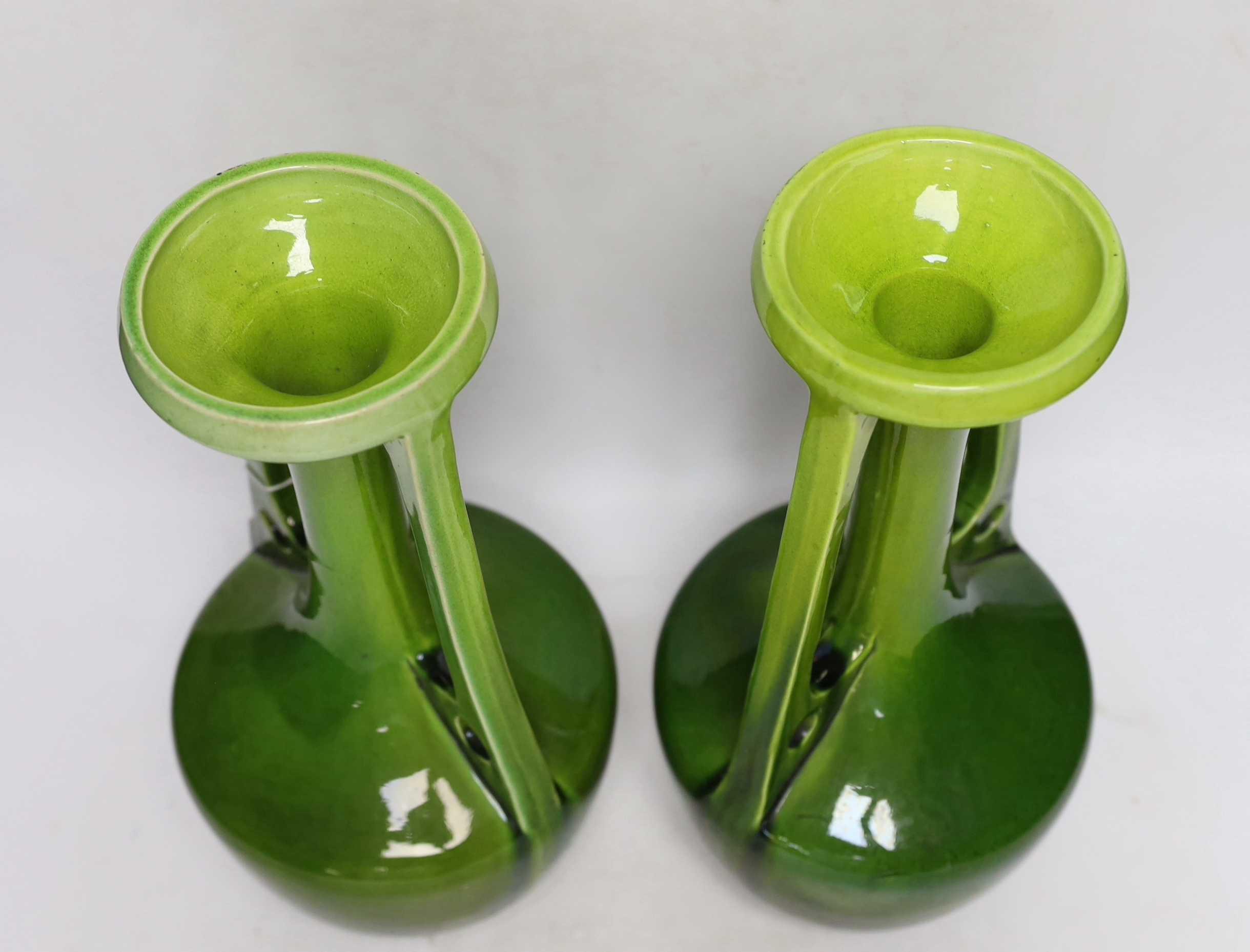 A pair of Bretby Arts and Crafts style vases, impressed model number 1565, circa 1900, 33cm high